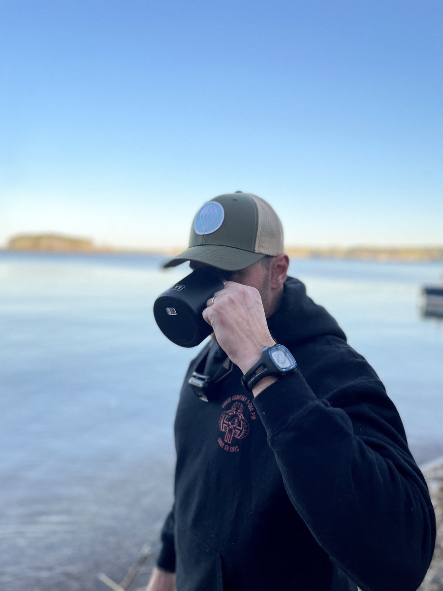 The CIVVIESUPPLY Airborne Trucker Hat Lifestyle Photo 2